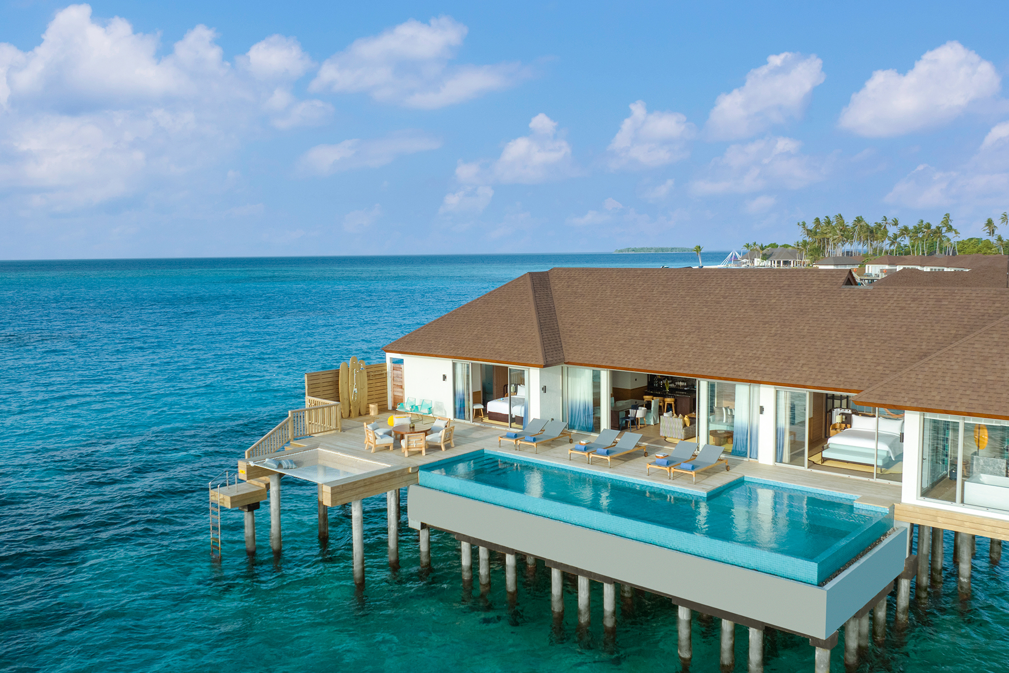 Avani + Fares Three Bedroom Sunset Overwater Pool Villa Living room