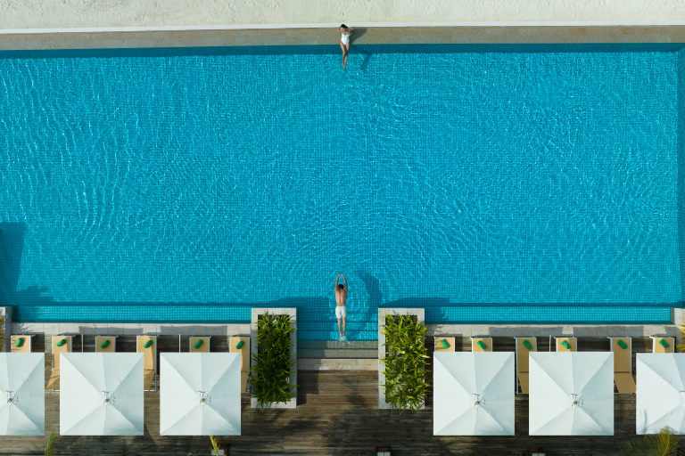 Emerald Faarufushi Resort & Spa Pool couple aerial