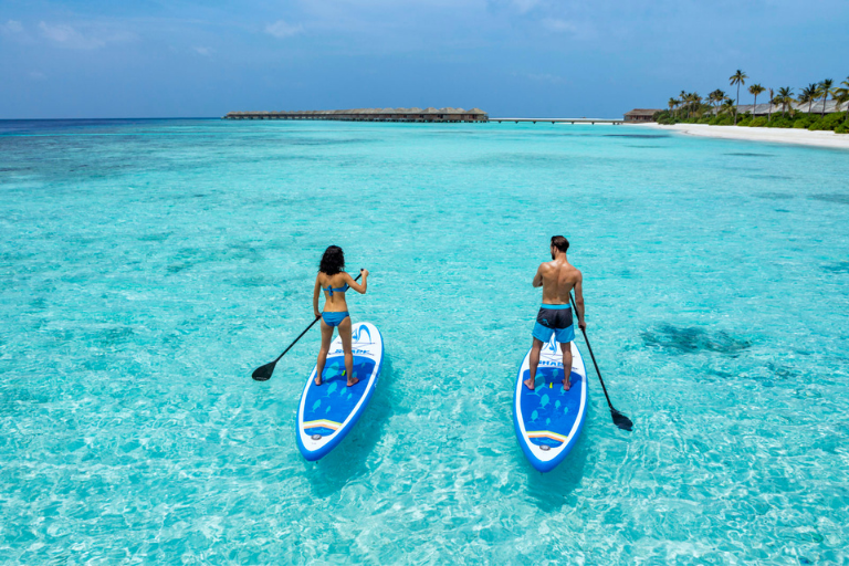 Hurawalhi Island Resort Maldives Paddleboarding couple