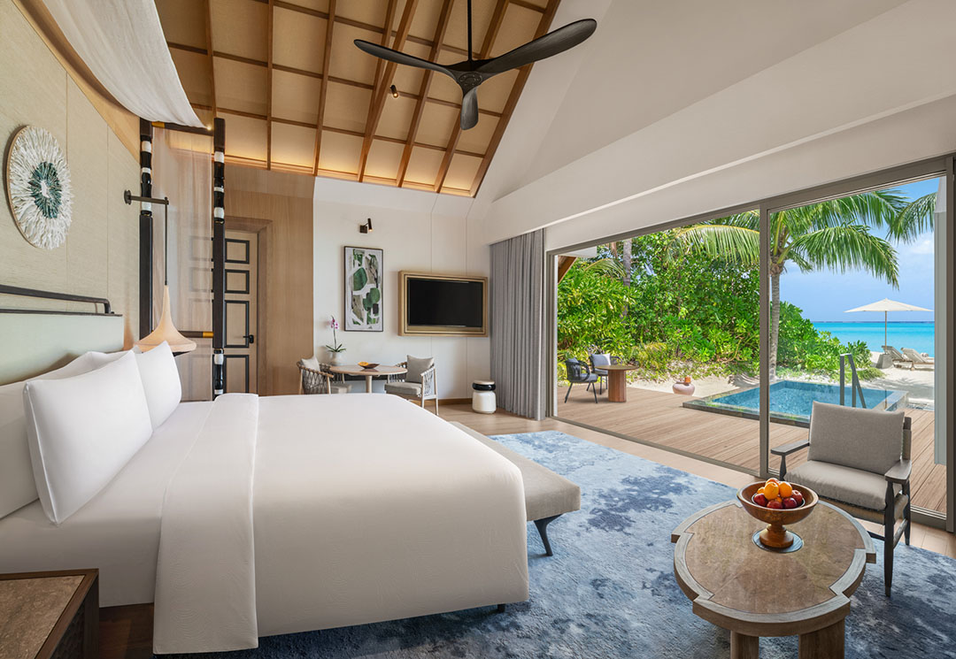 JW Marriott Kaafu Atoll Island Resort_Beach Pool Villa with Pool Interior view of a Beach Pool Villa with king size bed, dining table and an outdoor pool placed in the sun deck