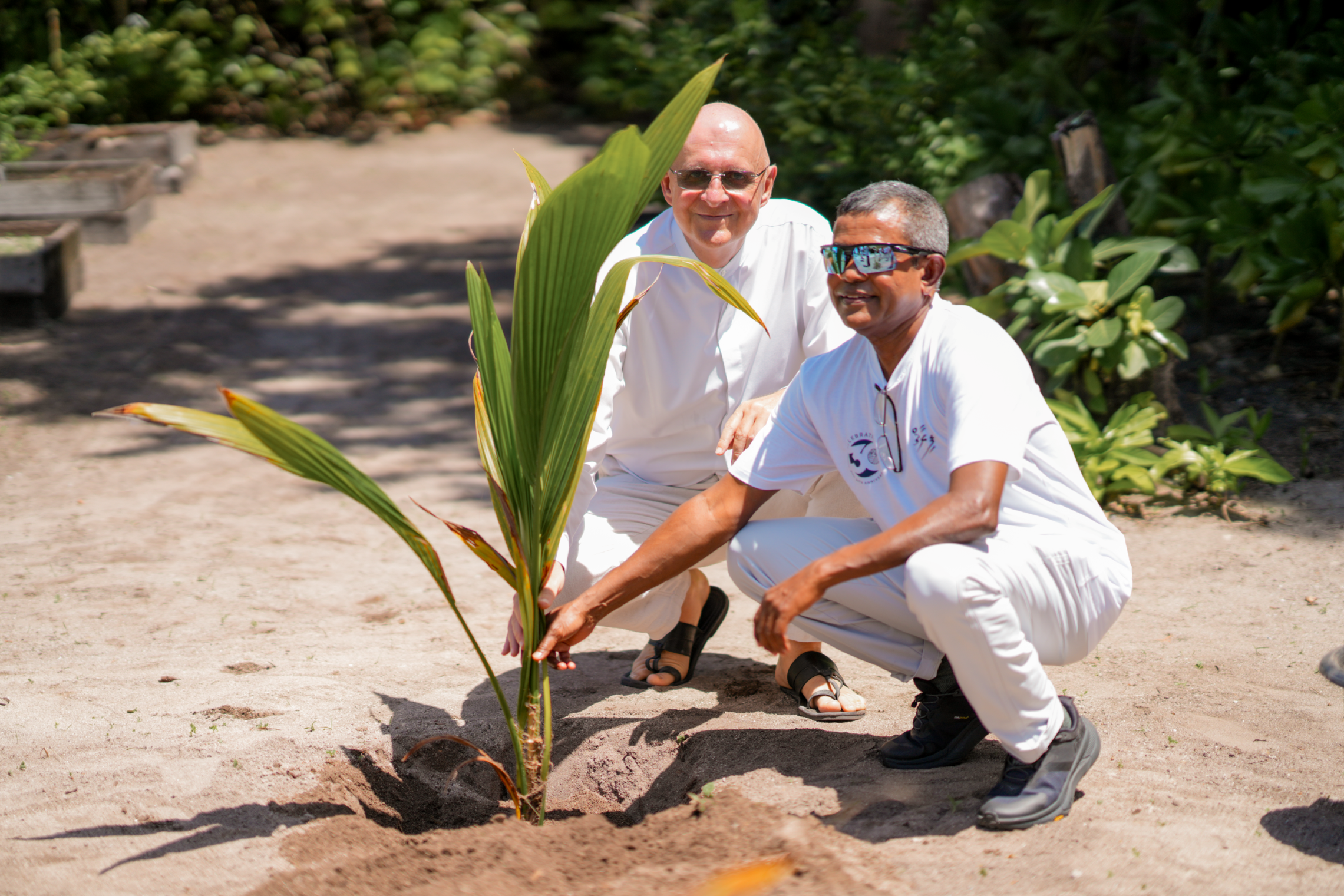 Intour MD & Four Seasons GM Coconut Planting