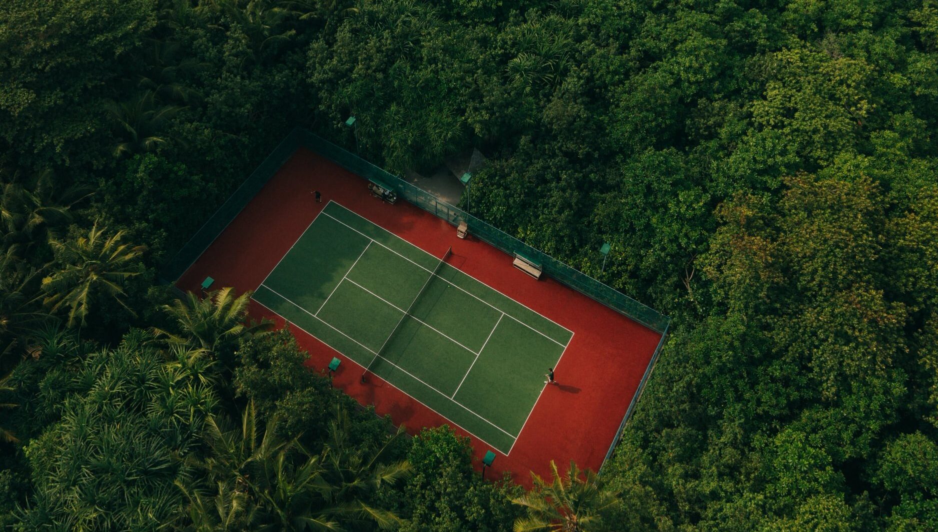 Soneva Fushi – Tennis & Padel – Open Air Tennis Court – Aerial (1) – Large